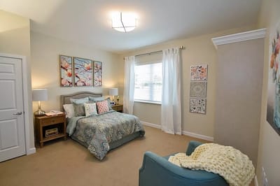 Well-decorated private resident room with bright lighting