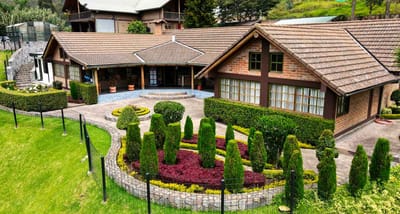 Exterior view of a well-manicured facility with gardens
