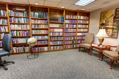 Cozy reading area with bookshelves and comfortable seating