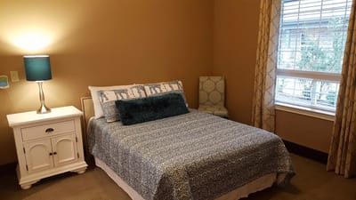 Cozy bedroom with a double bed and a window