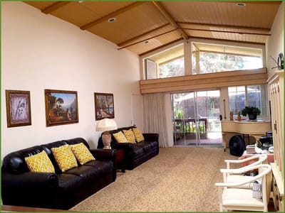 Bright lounge area with comfortable seating and artwork
