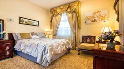 Well-decorated private resident room with floral accents