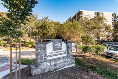 Exterior view of The Park Lane facility sign and building