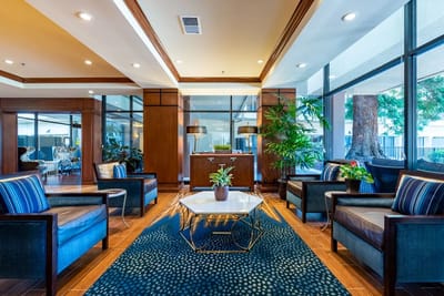 Interior view of a bright common area with seating