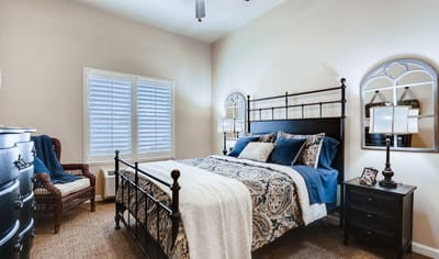 Cozy resident room with decorative bedding