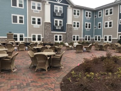 Outdoor seating area with tables and chairs in a courtyard