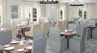 Dining room set up for meals with empty tables