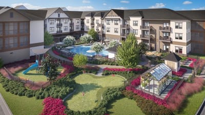 Aerial view of a community with gardens and outdoor pool