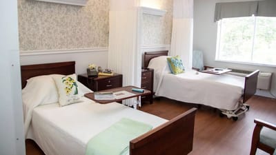 Two resident beds in a bright, shared room