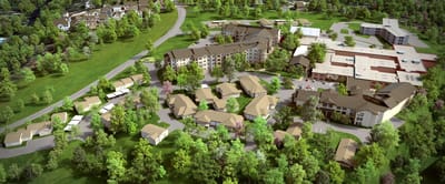 Aerial view of a senior living campus with landscaped grounds