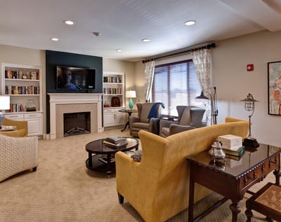 Bright common area with seating and a television