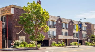 Exterior view of The Plaza At Westwood Senior Living building