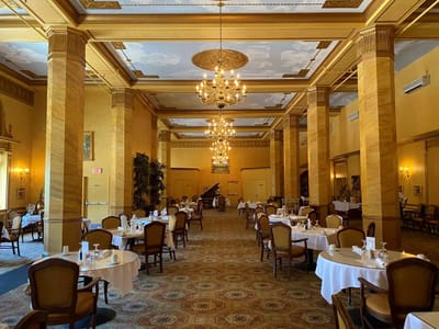 Elegant dining room with chandeliers and tables