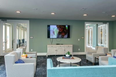 Bright common area with seating and a television