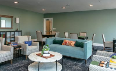 Bright common area with seating and plants