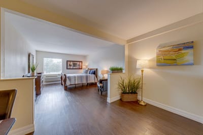 Brightly decorated resident room with warm lighting