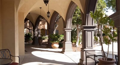 Courtyard with arches and potted plants