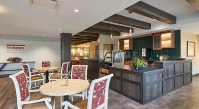 A cozy common area with a kitchen and seating