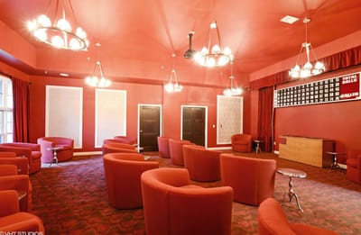 Interior view of a social lounge with red seating