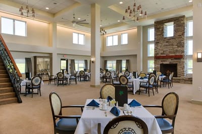 Bright and spacious dining room with tables and chairs