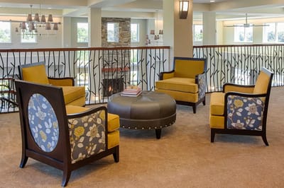 Common area seating with cozy chairs in a lounge