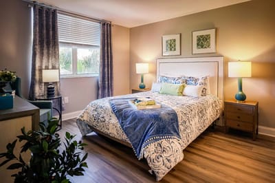Cozy bedroom with a made bed and natural light
