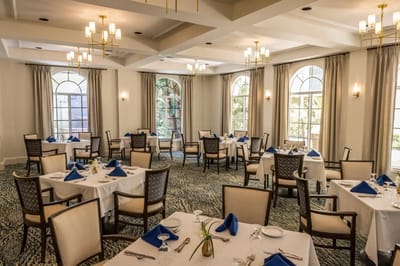 Elegant dining room setup with tables and tableware