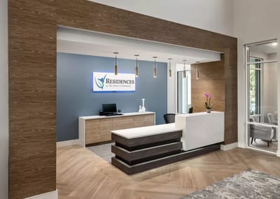 Reception area with facility branding and modern decor
