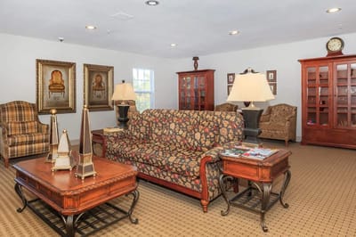 Bright interior common area with floral sofa and decor