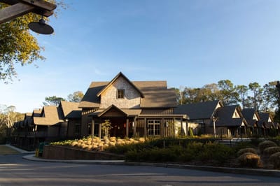 Exterior view of a senior living facility with landscaped entrance