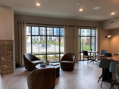 Interior common area with seating and outdoor views