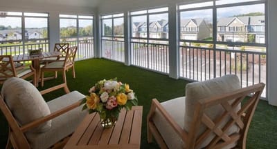 Stylish outdoor seating area with flower arrangement