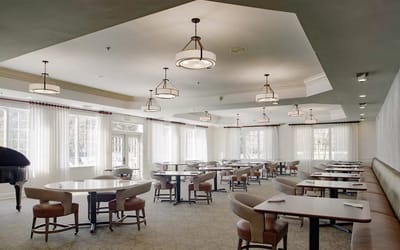 Dining area with tables and chairs in an elegant setting