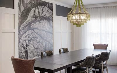 Bright common area with dining table and chandelier