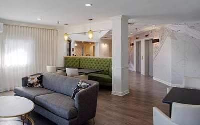 Bright common area with modern seating and decor