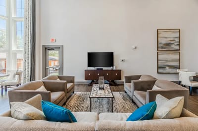 Bright common area with modern seating and decor