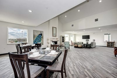 Interior common area with seating and dining setup
