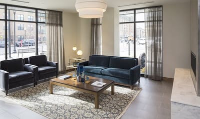 Bright common area with seating and large windows