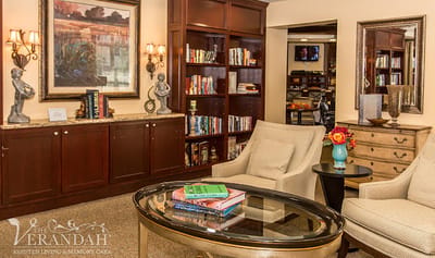 Cozy common area with seating and bookshelves