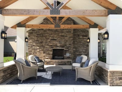 Outdoor seating area under a wooden pavilion