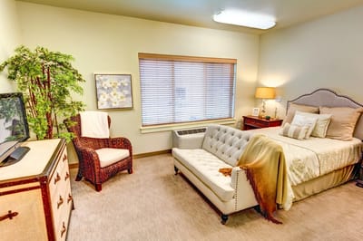 Cozy resident room with bed and seating area