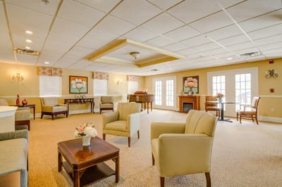 Bright common area with seating and piano