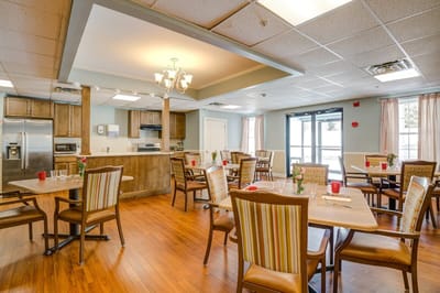 Dining room with tables and chairs set for a meal