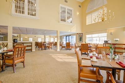 Bright and spacious dining area with tables and chairs
