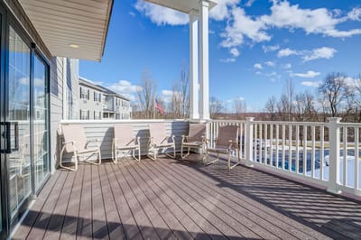 Patio area with chairs overlooking a green space