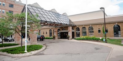 Entrance of a senior living facility with outdoor space