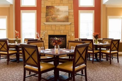 Dining room with tables and decorative fireplace