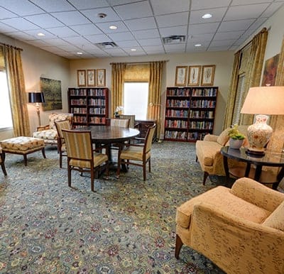 Interior view of a cozy reading room in a senior living facility