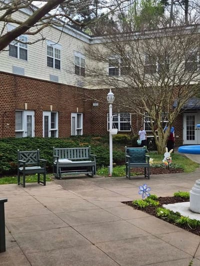 Outdoor courtyard with seating and residents