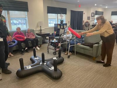 Residents participating in a fun activity in a common area